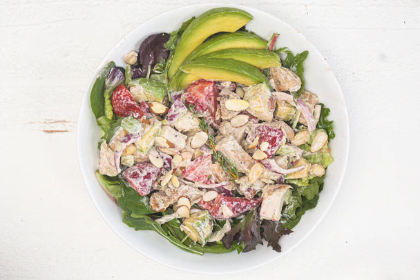 A bowl of strawberry chicken salad made with Primal Kitchen Mayo. 