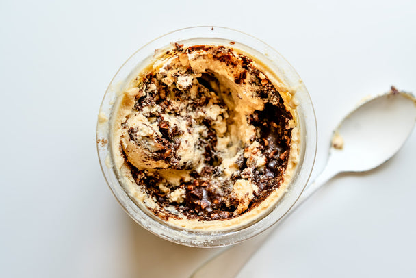 Overhead view into a jar of peanut butter chocolate ice cream made with Primal Kitchen collagen. 