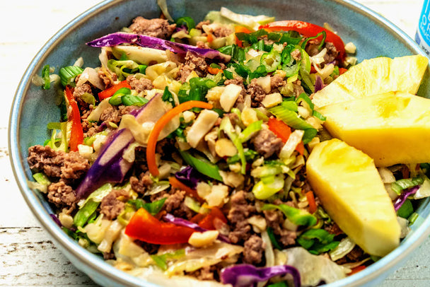 A gorgeous, colorful egg roll bowl made with Primal Kitchen Island Teriyaki Sauce. 