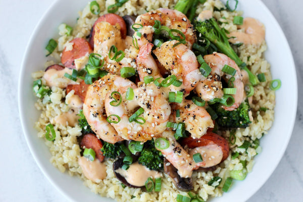 A bowl of hibachi-style shrimp over vegetables and cauliflower rice. 