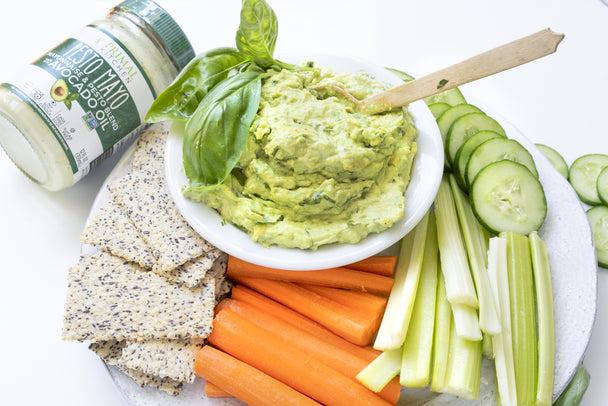 Creamy Guacamole with Celery Sticks, Carrot Sticks, Cucumber, and Crackers