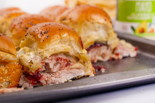 A tray of turkey cranberry sliders made with Primal Kitchen Avocado Mayo. 