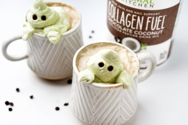 Mocha collagen coffee in white mugs with matcha whipped cream ghosts peeking out