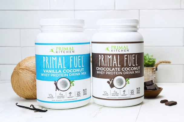 Canisters of Primal Kitchen Primal Fuel in Vanilla Coconut and Chocolate Coconut flavors.