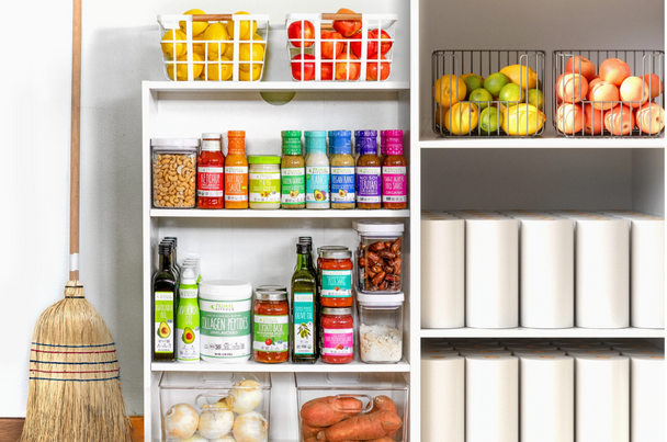 A pantry is filled with Primal Kitchen products and fresh fruits and vegetables.