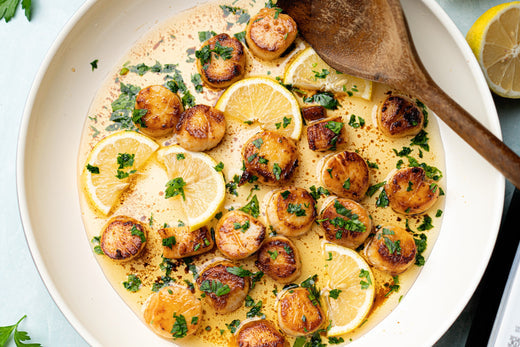 Lemon garlic scallops made with avocado oil, in a white bowl 