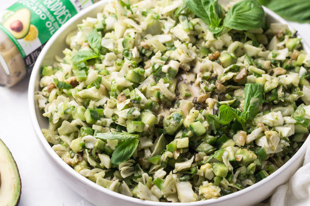 A large bowl of crisp, fresh salad with Primal Kitchen Green Goddess Dressing. 