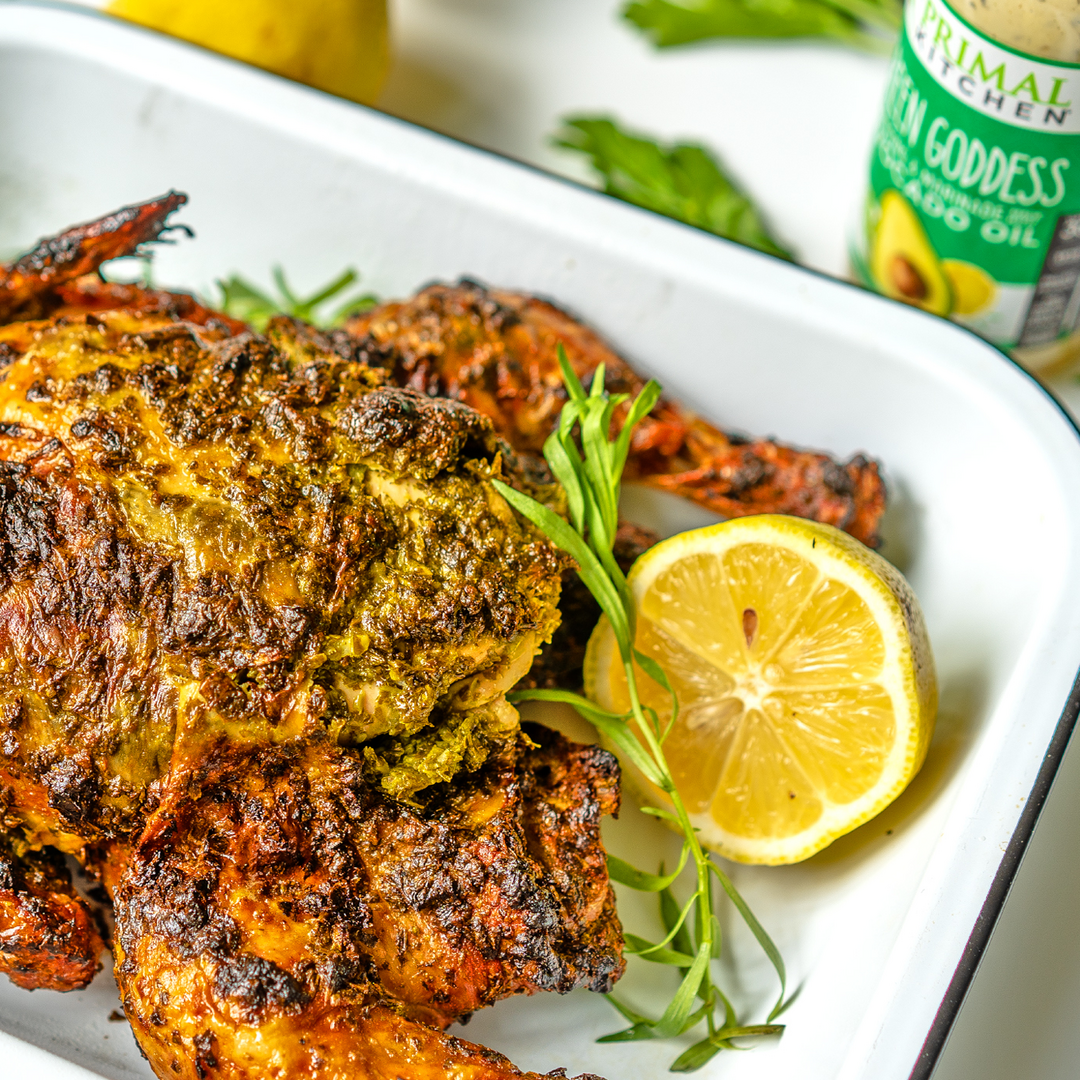 A roasted chicken marinaded in Primal Kitchen Green Goddess Dressing and Marinade made with Avocado Oil.