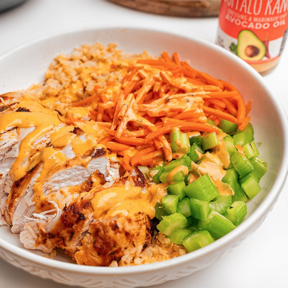 Chicken Bowl with Primal Kitchen Buffalo Ranch Drizzled on top.