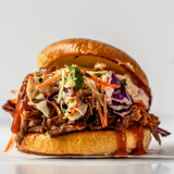 A short rib sandwich with Korean BBQ Sauce dripping.