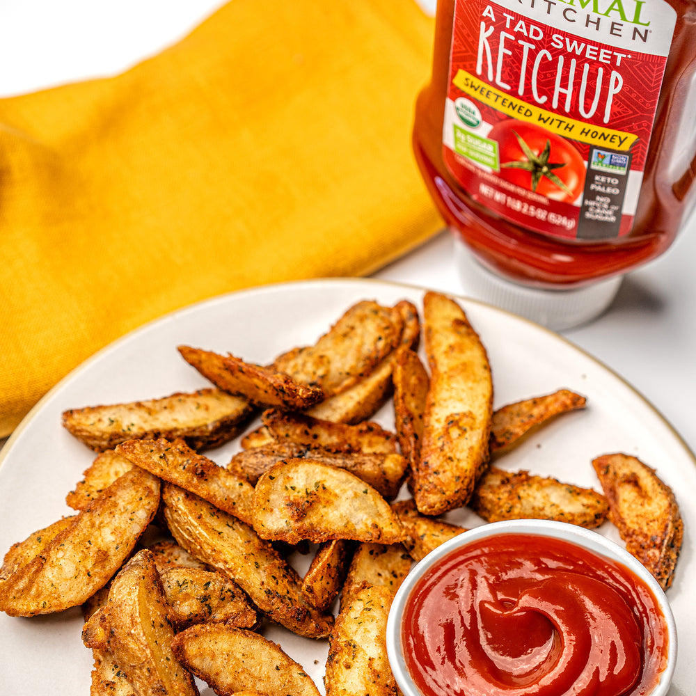 Tad Sweet Ketchup with a plate of Potato Wedges.